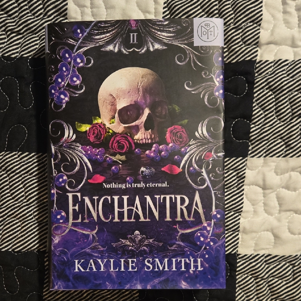 Enchantra Book with Skull and Roses Cover